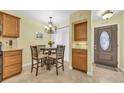 Kitchen dining area with glass-top table and four chairs at 307 20Th Ave. S # 4B, Myrtle Beach, SC 29577