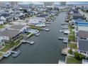 Aerial view of waterfront homes with private docks and boats at 333 54Th Ave. N, North Myrtle Beach, SC 29582