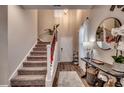 Bright and spacious entryway with stairs, mirror, and console table at 5433 Merrywind Ct., Myrtle Beach, SC 29579