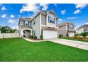 Two-story house with gray siding, stone accents, and a two-car garage at 5433 Merrywind Ct., Myrtle Beach, SC 29579