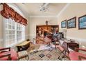 Home office with built-in shelving and hardwood floors at 5603 Leatherleaf Dr., North Myrtle Beach, SC 29582