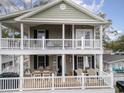 Two-story house with large deck and outdoor seating at 6001-Mh119B S Kings Hwy., Myrtle Beach, SC 29575