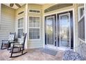 Inviting front porch with rocking chairs and double doors at 190 Sugar Loaf Ln., Murrells Inlet, SC 29576