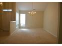 Bright dining room with chandelier and carpet flooring at 2304 Blackbird Ct., Murrells Inlet, SC 29576