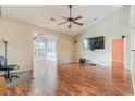 Spacious living room featuring hardwood floors and a large TV at 448 Blackberry Ln., Myrtle Beach, SC 29579