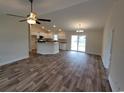 Open living room and kitchen with vinyl plank flooring at Tbb 1 Pee Dee Hwy., Conway, SC 29527