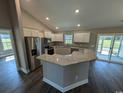 L-shaped kitchen island with granite countertops and stainless steel appliances at Tbd 2 Mineral Springs Rd., Conway, SC 29527