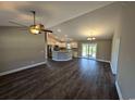 Open floor plan living room with dark flooring and kitchen island at Tbd 2 Mineral Springs Rd., Conway, SC 29527