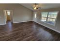 Open living room with hardwood floors, high ceilings, and views of hallway at Tbd 3 Mineral Springs Rd., Conway, SC 29527