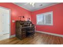 Bright bedroom with hardwood floors and built-in desk at 1100 Commons Blvd. # 716, Myrtle Beach, SC 29572