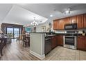 Modern kitchen featuring stainless steel appliances and dark wood cabinetry at 2600 North Ocean Blvd. # 211, Myrtle Beach, SC 29577