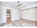 Open dining area with wood-look flooring and a modern light fixture at 268 Empyrean Circle, Myrtle Beach, SC 29588