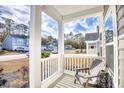 Inviting front porch with seating and a view of the neighborhood at 268 Empyrean Circle, Myrtle Beach, SC 29588