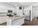 Modern kitchen with stainless steel appliances, granite countertops, and white cabinets at 351 Brackish Dr. # 351, Myrtle Beach, SC 29588