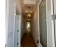 Light-filled entry hallway with hardwood floors at 493 Ayrhill Loop, Myrtle Beach, SC 29588