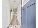 Bright entryway with hardwood floors, leading to stairs and open living area at 608 Montenegro Way # E, Myrtle Beach, SC 29579