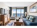 Living room with ocean views, comfortable seating, and a TV at 6804 N Ocean Blvd. # 1215, Myrtle Beach, SC 29572