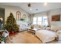 Inviting living room featuring vaulted ceilings, comfy seating, and holiday decorations at 179 Springtide Dr., Conway, SC 29527
