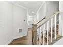 View of the staircase and wood-look flooring from the foyer at 308 Golan Circle # C, Myrtle Beach, SC 29579