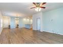 Open-concept living area with wood-look flooring, a ceiling fan, and recessed lighting at 509 Covewood Ct., Longs, SC 29568