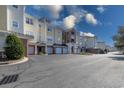 View of the condo building exterior with attached garages and landscaping at 6203 Catalina Dr. # 524, North Myrtle Beach, SC 29582