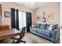 Cozy home office or den with a comfortable couch, desk, and natural light at 785 Rambler Ct., Myrtle Beach, SC 29579