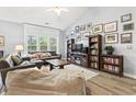 Spacious living room with high ceilings, built-in bookcase, and ample natural light at 785 Rambler Ct., Myrtle Beach, SC 29579