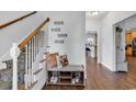 Welcoming entryway with staircase, bench, and view of the kitchen at 121 Triple Crown Ct., Myrtle Beach, SC 29579