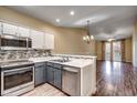 Updated kitchen with stainless steel appliances and breakfast bar at 1286 River Oaks Dr. # 8-M, Myrtle Beach, SC 29579