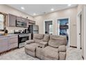 Kitchen and living room area with stainless steel appliances and tile floor at 1744 Log Cabin Rd., Loris, SC 29569