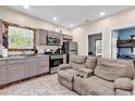 Kitchen and living area with stainless steel appliances and tile floor at 1744 Log Cabin Rd., Loris, SC 29569