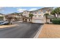 Building exterior with garage and landscaped grounds at 2180 Waterview Dr. # 324, North Myrtle Beach, SC 29582