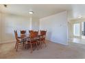 Dining area with a wooden table and chairs, and carpeted flooring at 2555 Mount Olive Rd., Loris, SC 29569