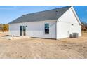 Rear exterior showcasing a patio and sliding glass door access at 3427 B And S Rd., Loris, SC 29569