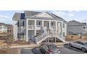 Two-story condo building with balconies and parking in front at 4924 Pond Shoals Ct. # 101, Myrtle Beach, SC 29579