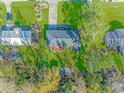 An aerial view showcasing the home's lot size, location, and surrounding trees at 5080 Forest Dr., Loris, SC 29569