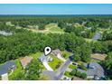 High-angle neighborhood view showcasing a golf course and the surrounding community at 765 Ashley Manor Dr., Longs, SC 29568