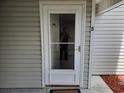 White front door with glass panels at 8649 Southbridge Dr. # B, Surfside Beach, SC 29575