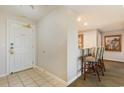 Condo entryway with white door, breakfast bar, and tiled floor at 9994 Beach Club Dr. # 1604, Myrtle Beach, SC 29572