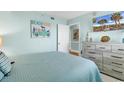 Bedroom with dresser, TV, and coastal decor at 201 S Ocean Blvd. # 1602, North Myrtle Beach, SC 29582