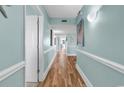 Light and bright hallway with wood-look flooring at 201 S Ocean Blvd. # 1602, North Myrtle Beach, SC 29582