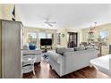 Living room featuring two sofas, a TV, and access to a balcony at 501 Maison Dr. # A-21, Myrtle Beach, SC 29572