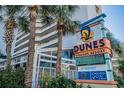 Dunes Village Resort sign with information and hours at 5300 N Ocean Blvd. # 1011, Myrtle Beach, SC 29577