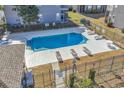 Community pool with lounge chairs at 712 Algonquin Dr. # A, Pawleys Island, SC 29585