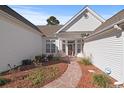 Welcoming front entrance with a walkway and landscaping at 126 Pickering Dr., Murrells Inlet, SC 29576