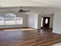 Bright and airy living room with hardwood floors and large windows at 1608 Fox Hollow Ct., Marion, SC 29571