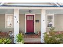 Inviting front porch with red door and white columns at 313 Front St., Georgetown, SC 29440