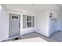 Gray front door, white siding, and attached garage at 4056 Bucolic Loop, Myrtle Beach, SC 29588