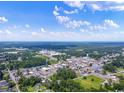 Aerial view of a town with lush green spaces and buildings at 435 Ribbon Rail Way, Loris, SC 29569