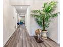 Long hallway with hardwood floors, leading to living areas at 4551 Day Lily Run St., Myrtle Beach, SC 29579